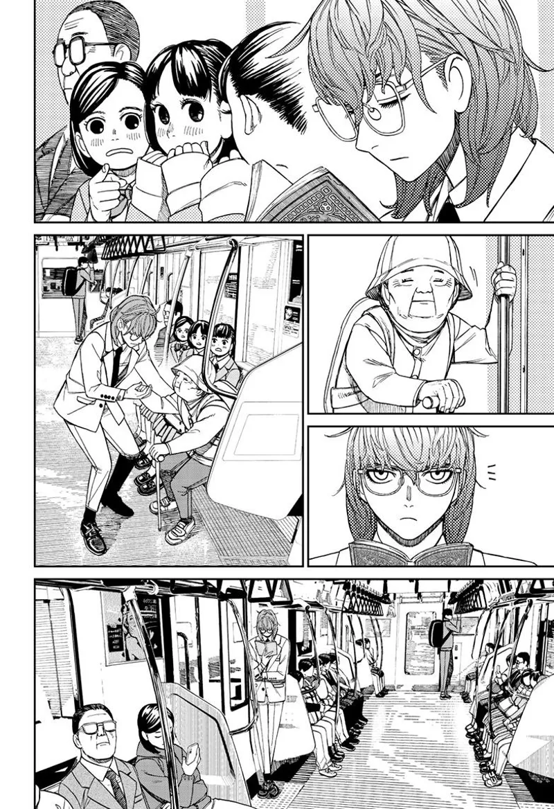 The man rides a train and lets an elderly sit in his chair. He stands up.
