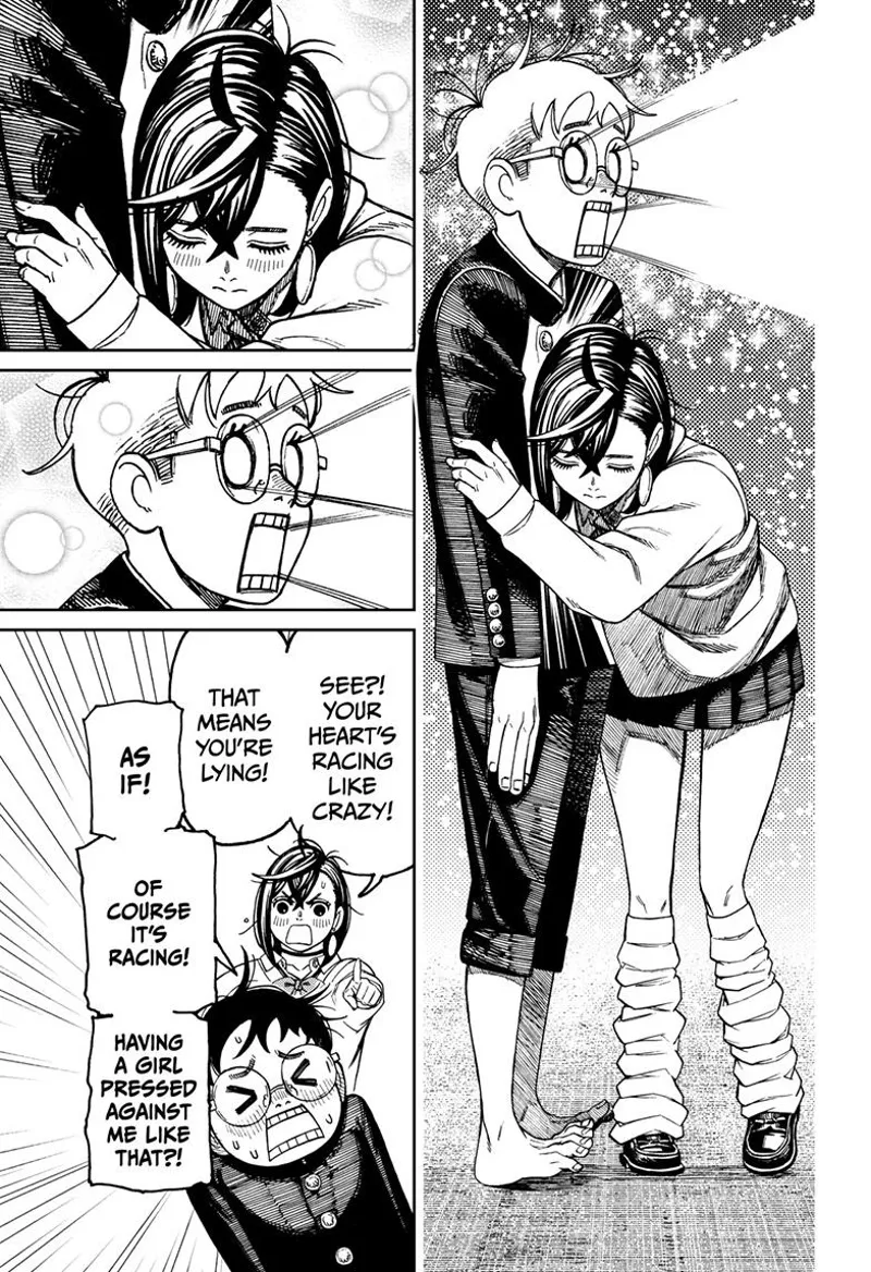 Momo bends and listens to Okarun's heart. Okarun's eyes and mouth light up.