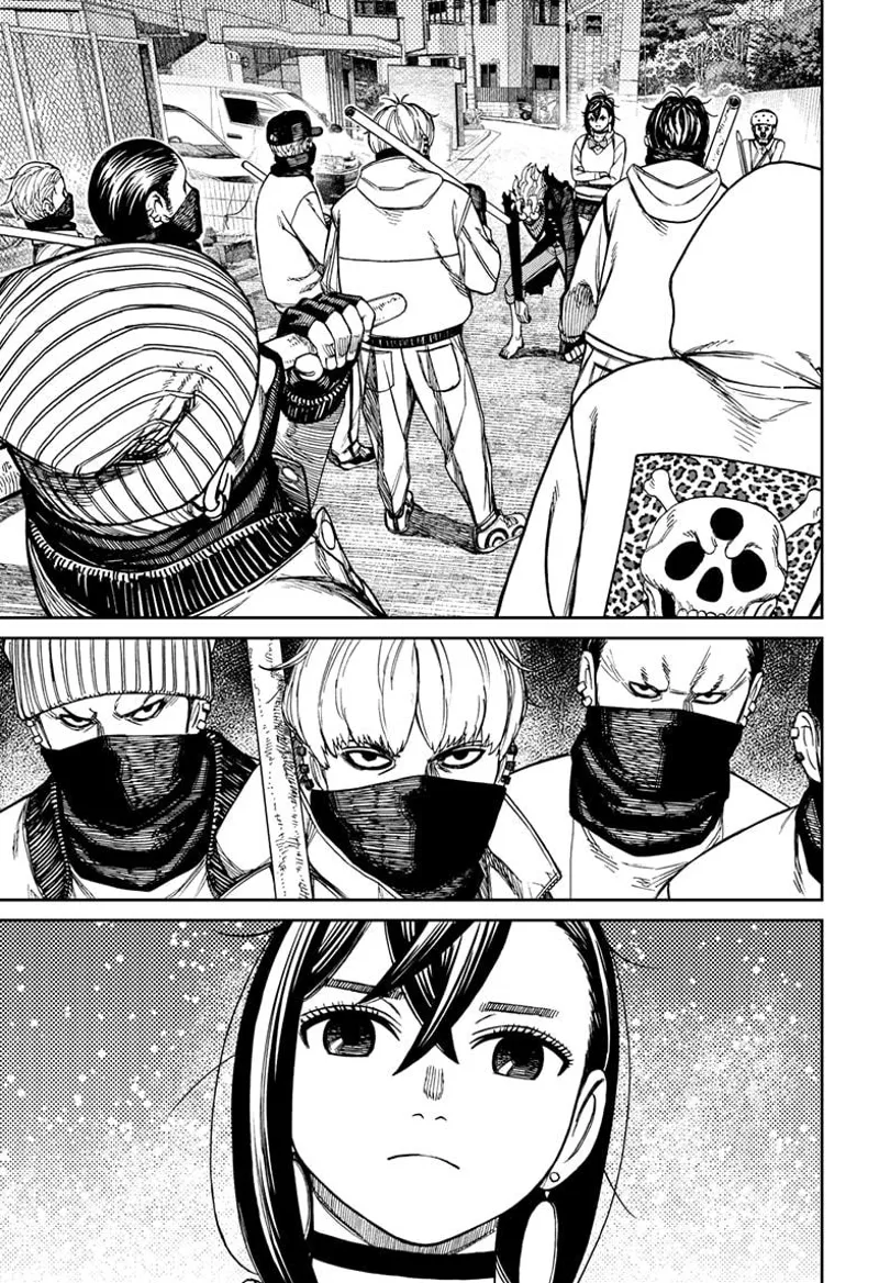 The thugs and Momo stare at each other.