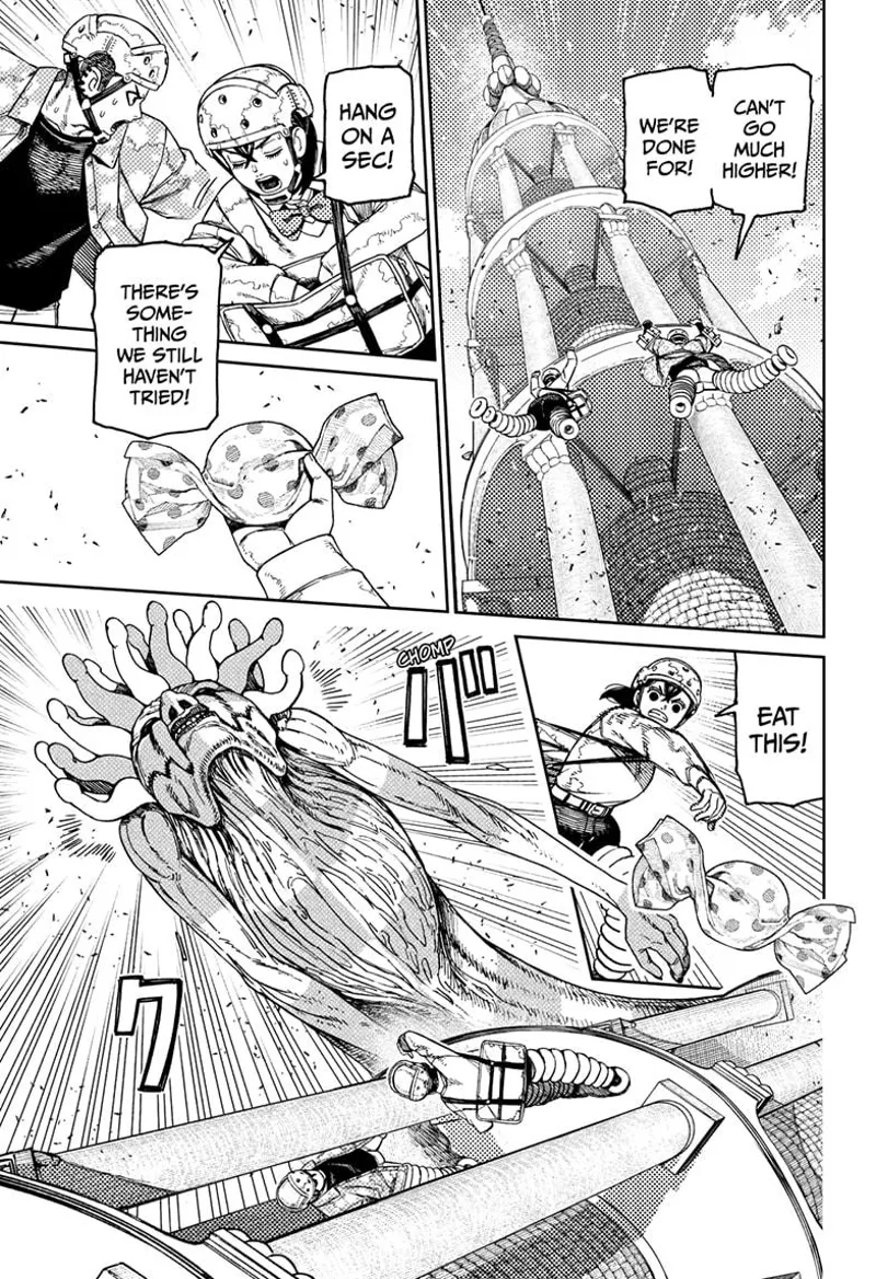 Momo and Zuma are almost at the top. Momo grabs a candy and throws it. The snake monster snaps the candy and eats it.