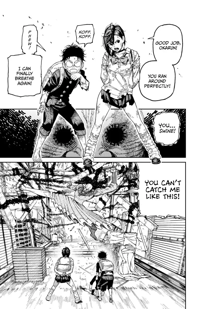 Momo and Okarun stands. Okarun picks up Aira. Acro-Silky starts kicking the metal beams and columns.