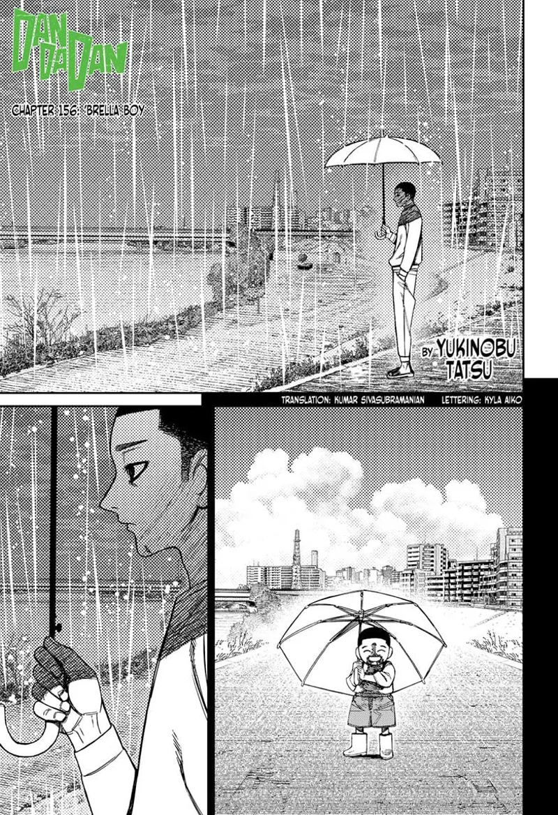 Unji Zuma watches the river while holding an umbrella under the heavy rain. He recalls his younger brother.