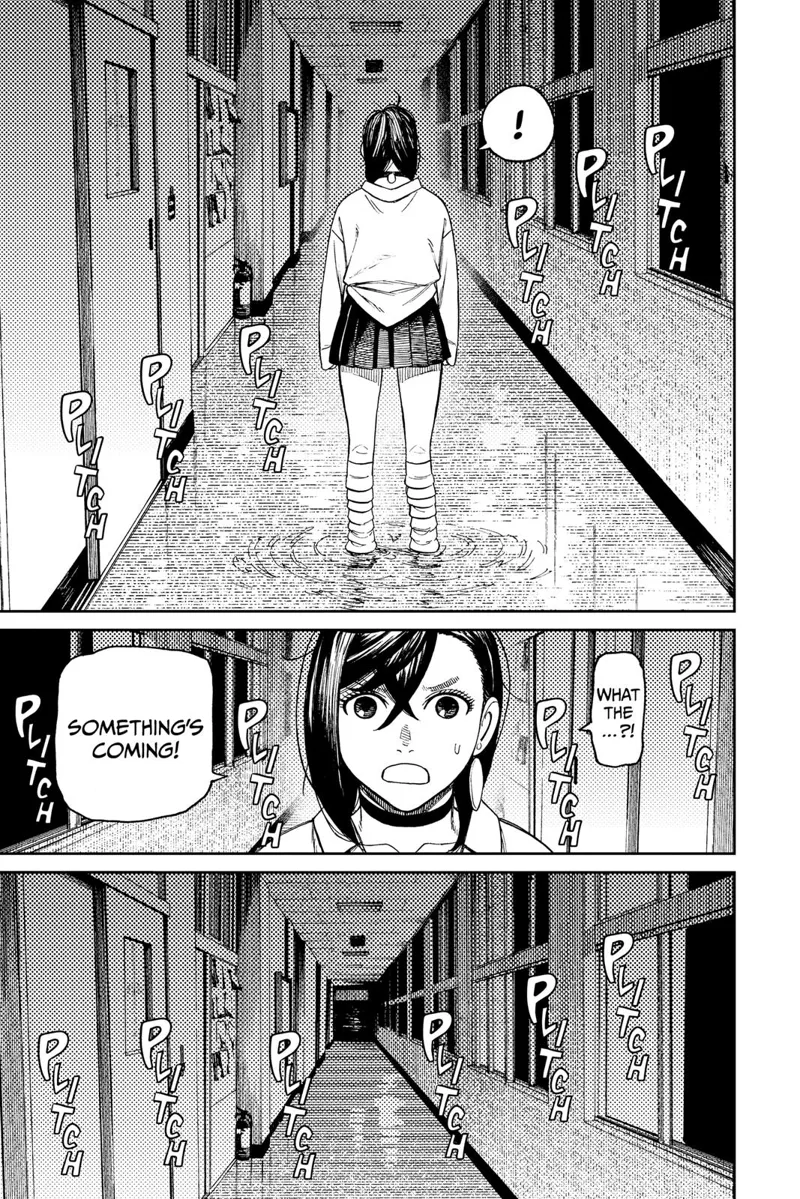 Momo stands in the middle of the corridor and hears some noises.