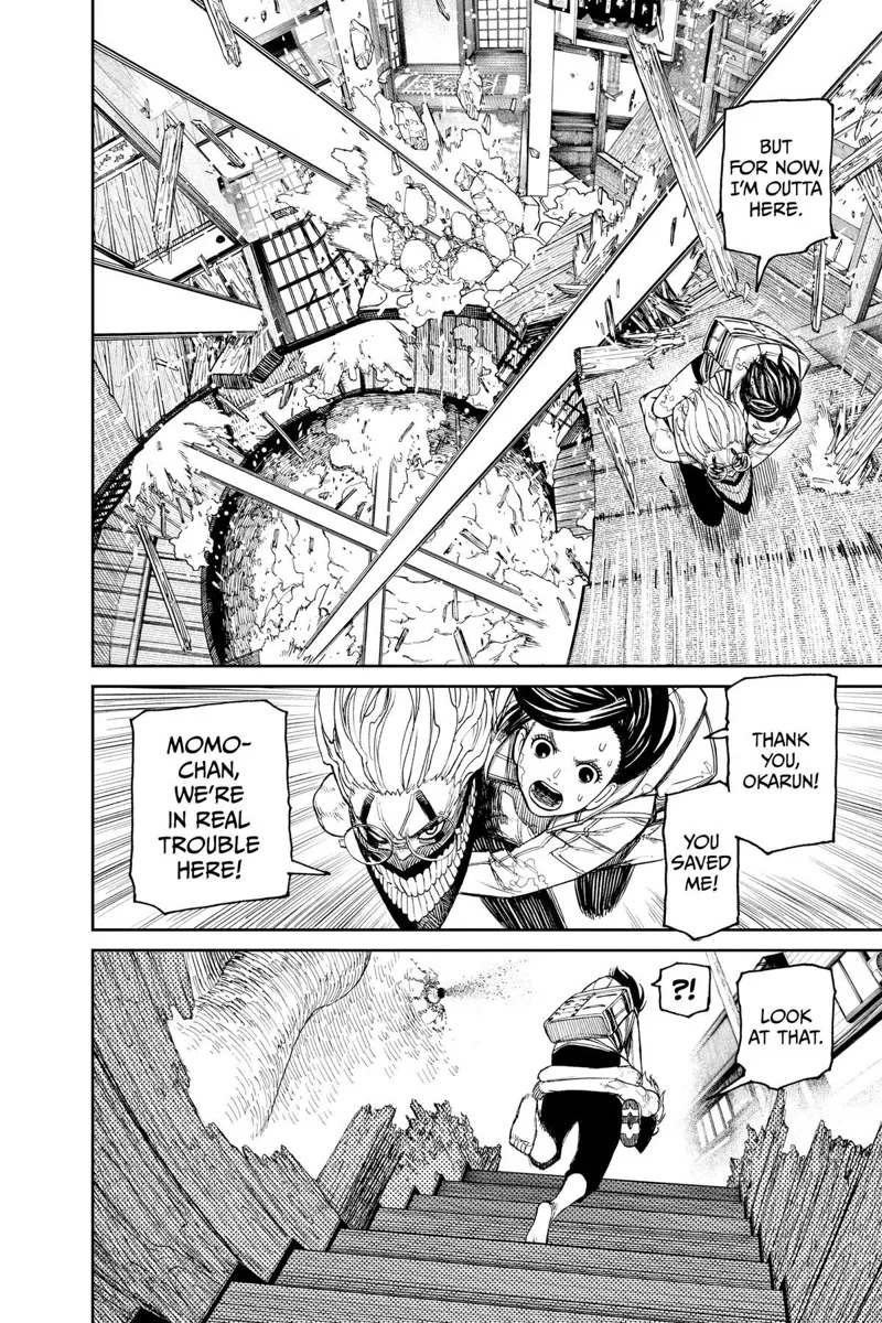 Okarun carries Momo as they move up the stairs, Avoiding Jiji's spirit ball that's destroying the house.