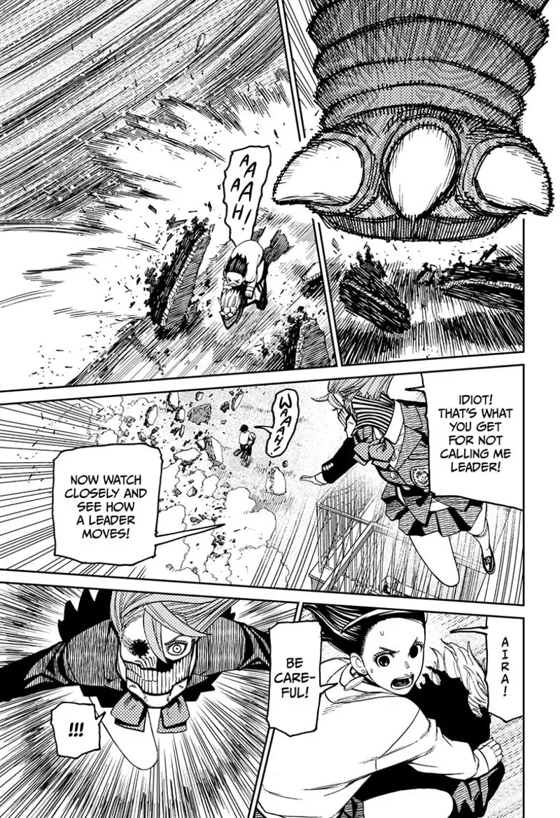 Cursed Okarun carries Momo as they dodge the monster's foot. Air jumps high to attack the Kaiju.