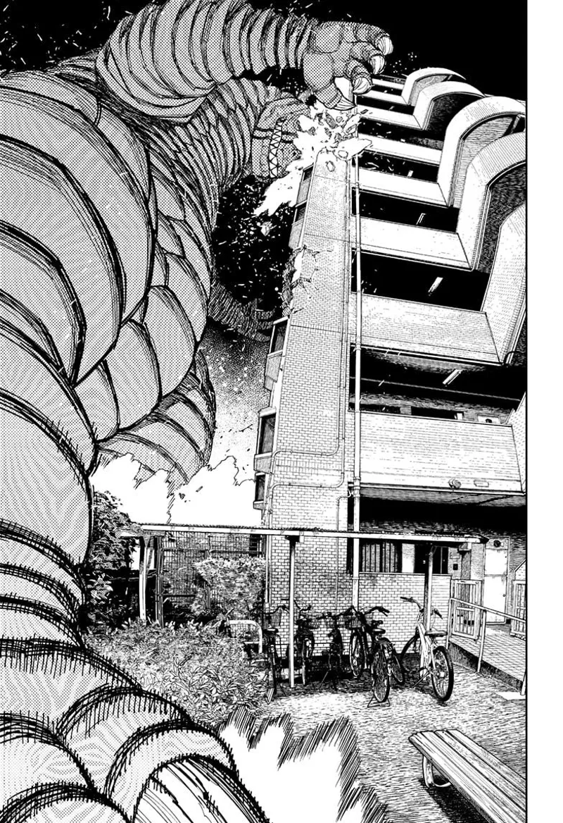 The Kaiju becomes very big and smashes its head into the building.