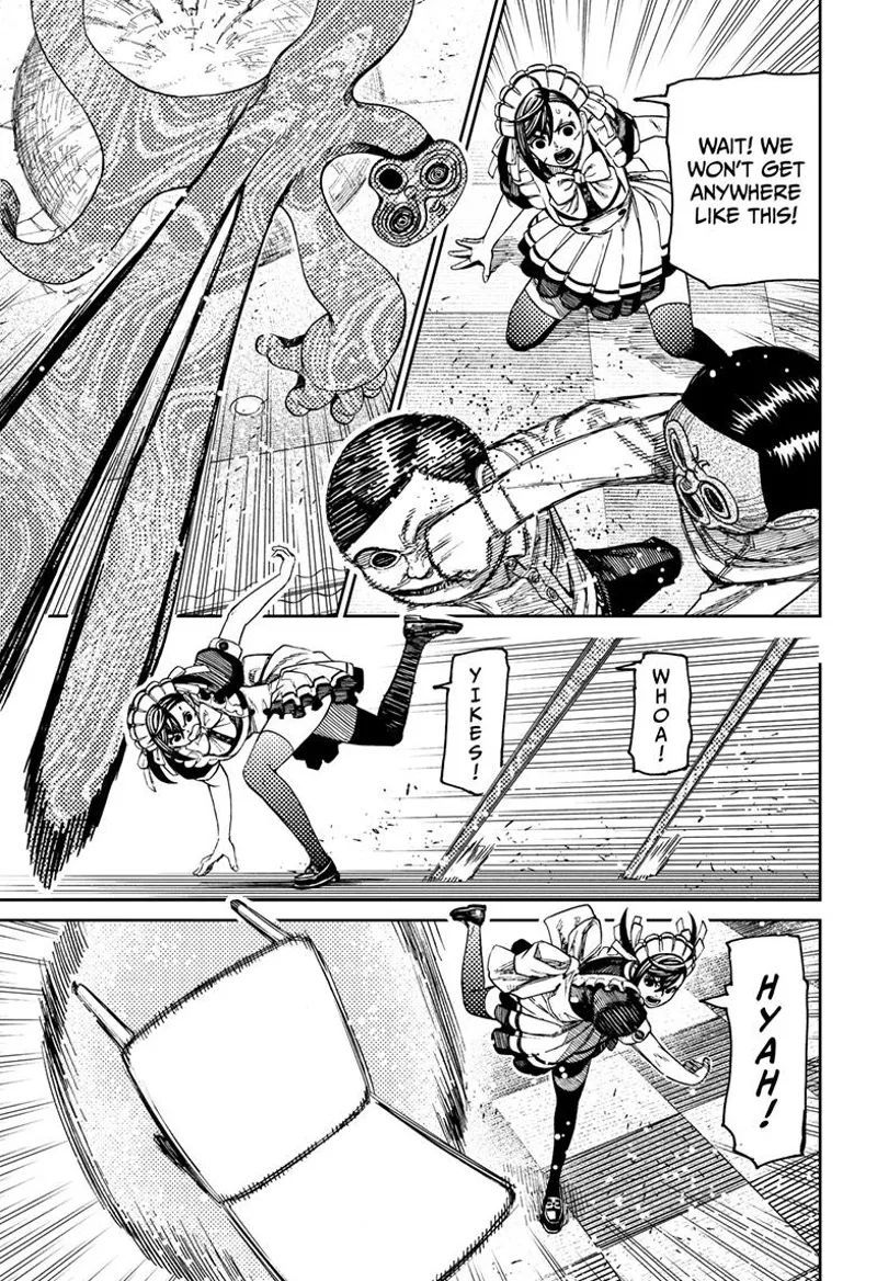 Momo dodges the weird enemy's attack and throws a chair at it.