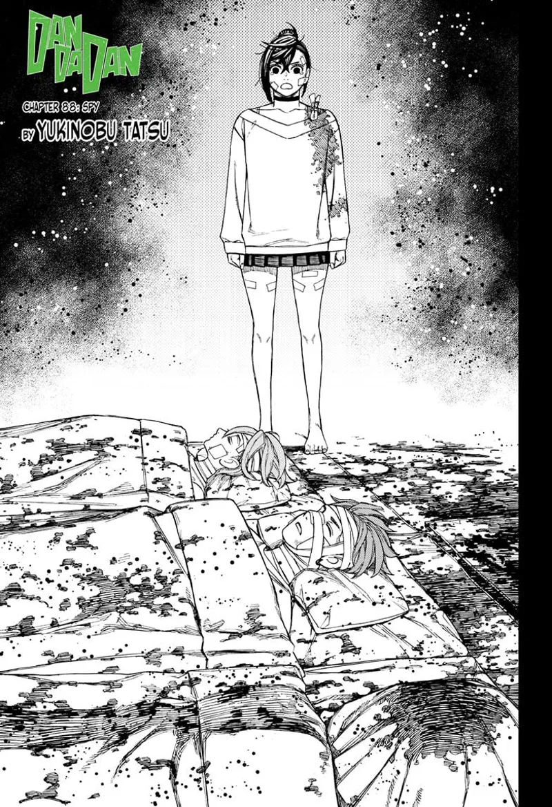 Momo stands before her unconscious friends, who are in bed bloody and heavily injured.